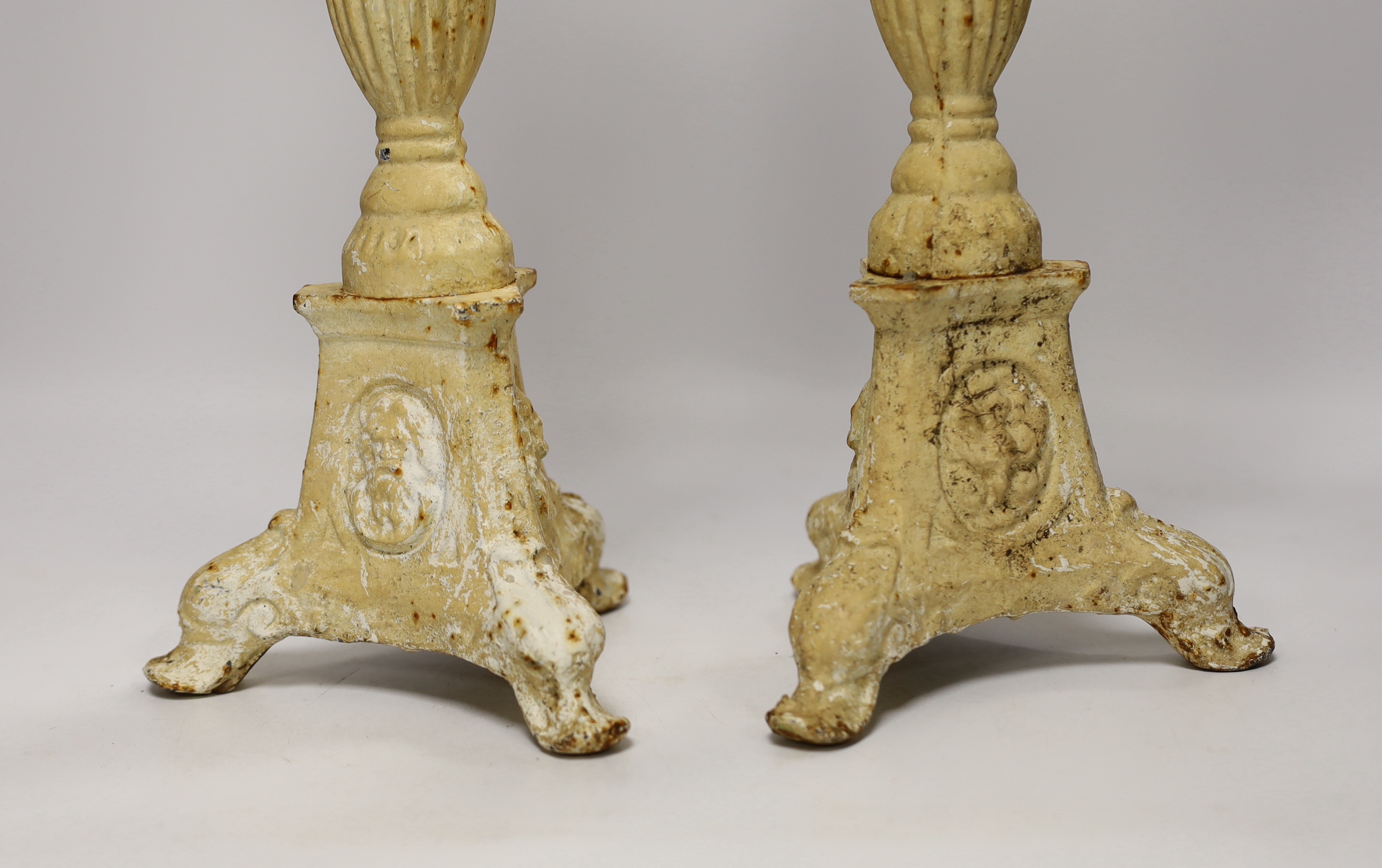 A pair of period-style cast iron candlesticks, 43cm